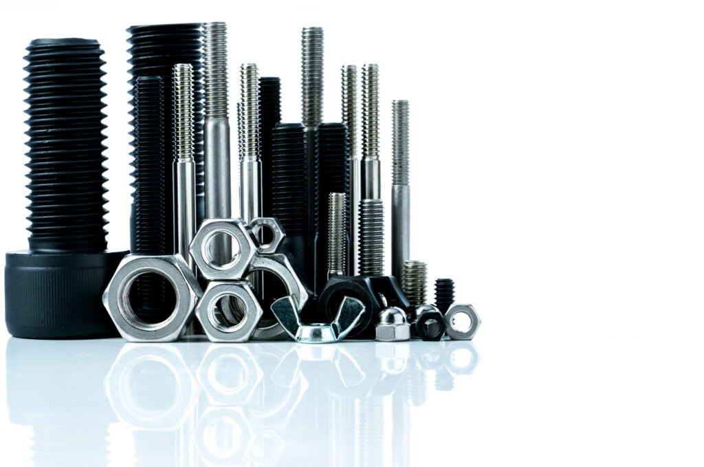 Metal bolts and nuts on white background