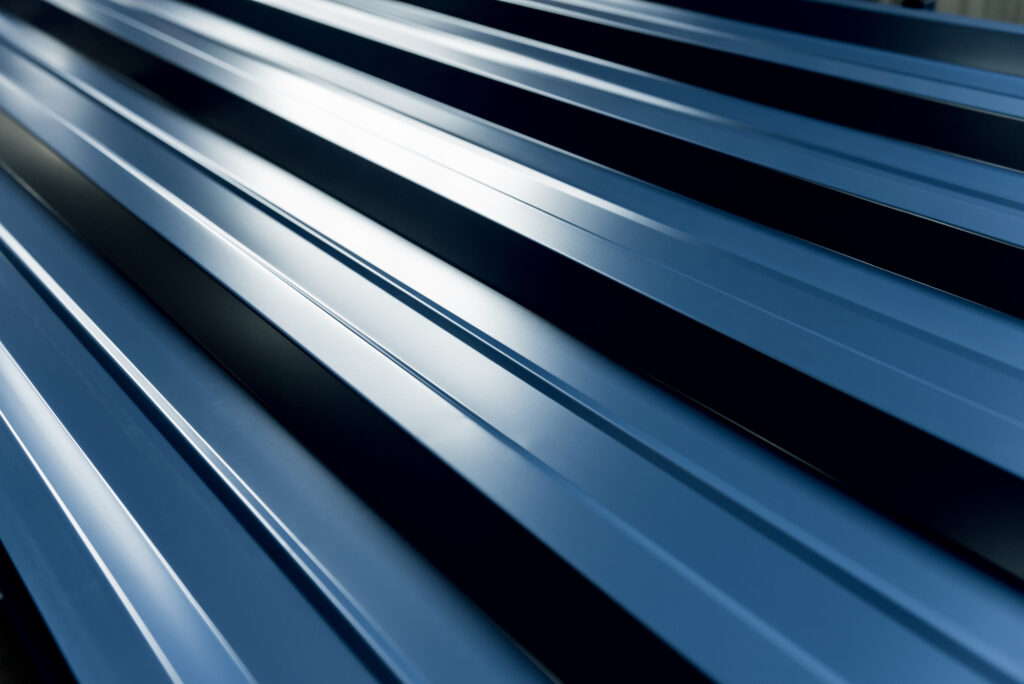 Blue metallic roof tiles background with drops of water