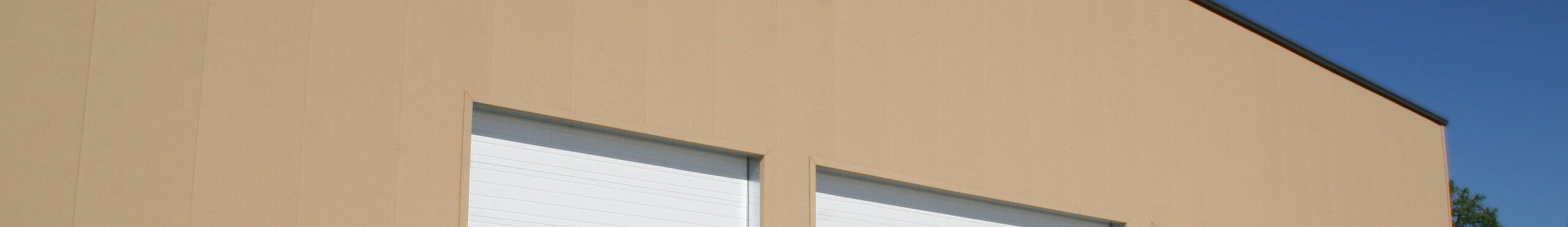 Butler TextureWall Stucco insulated metal sandwich panel IMP profile showing hard aggregate Texture-Cote stucco exterior finish poured-in-place foam core insulation and flat white polyester interior panel face for commercial retail church and community facility building applications