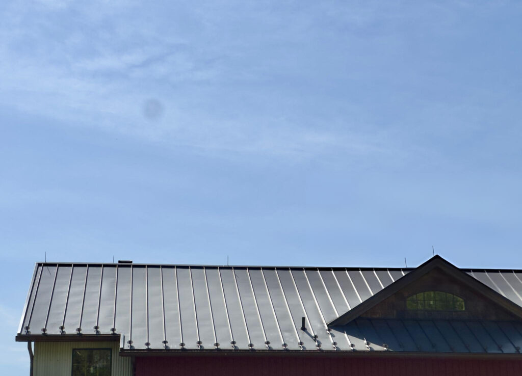 Butler MR-24 standing seam metal roof system compatible with OptiLiner insulation high clip system for enhanced R-value performance