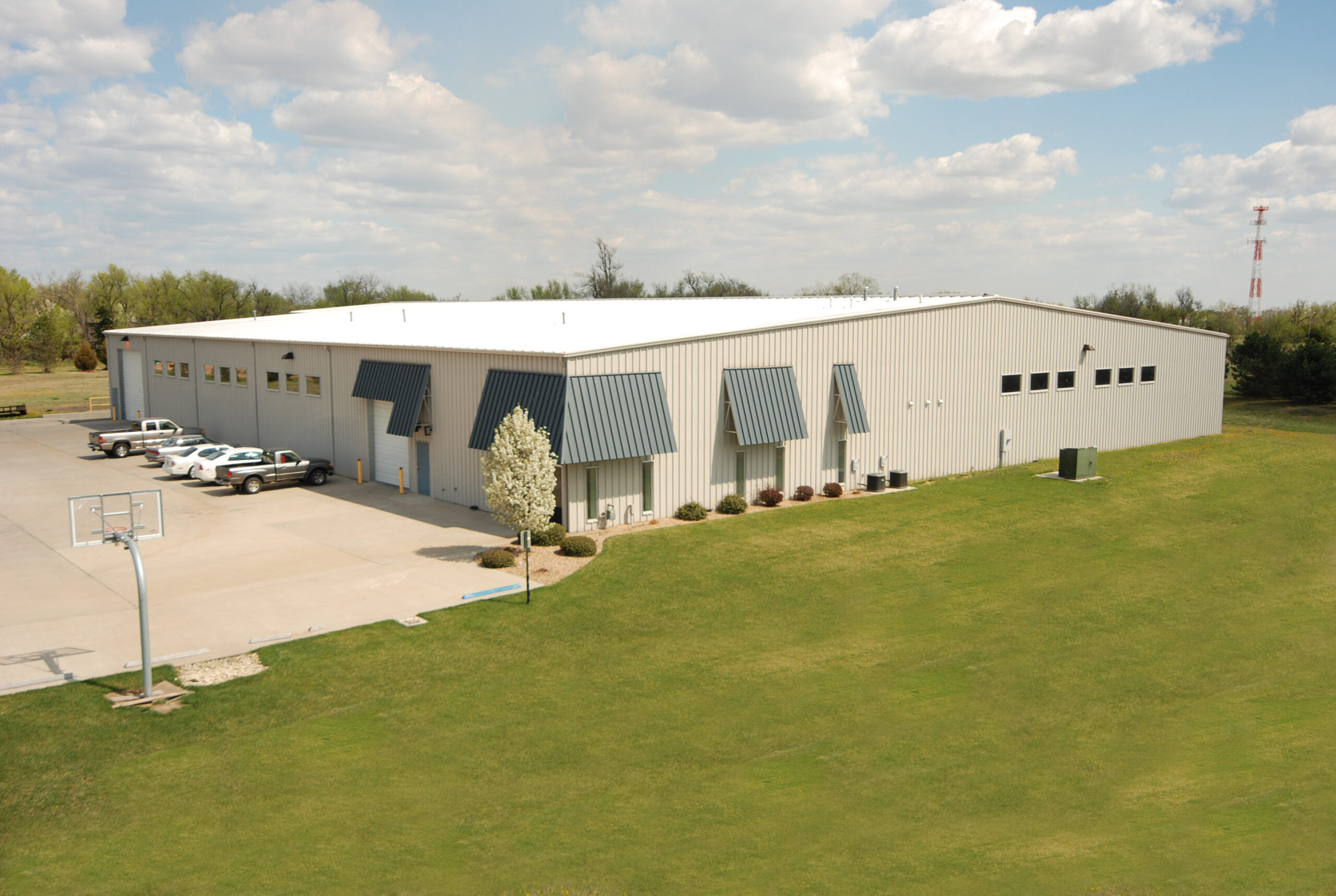 Large Butler metal building for warehouse distribution or agricultural processing use in California's Central Valley built to meet California Title 24 seismic and energy code requirements