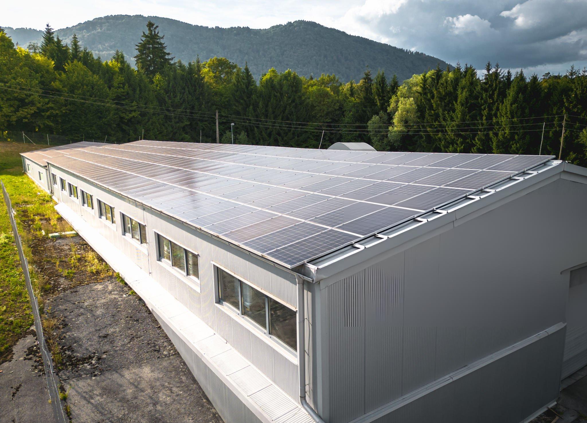 Solar panels mounted on Butler MR-24 standing seam metal building roof using clamp-on attachment system with no roof penetrations for commercial and industrial facilities