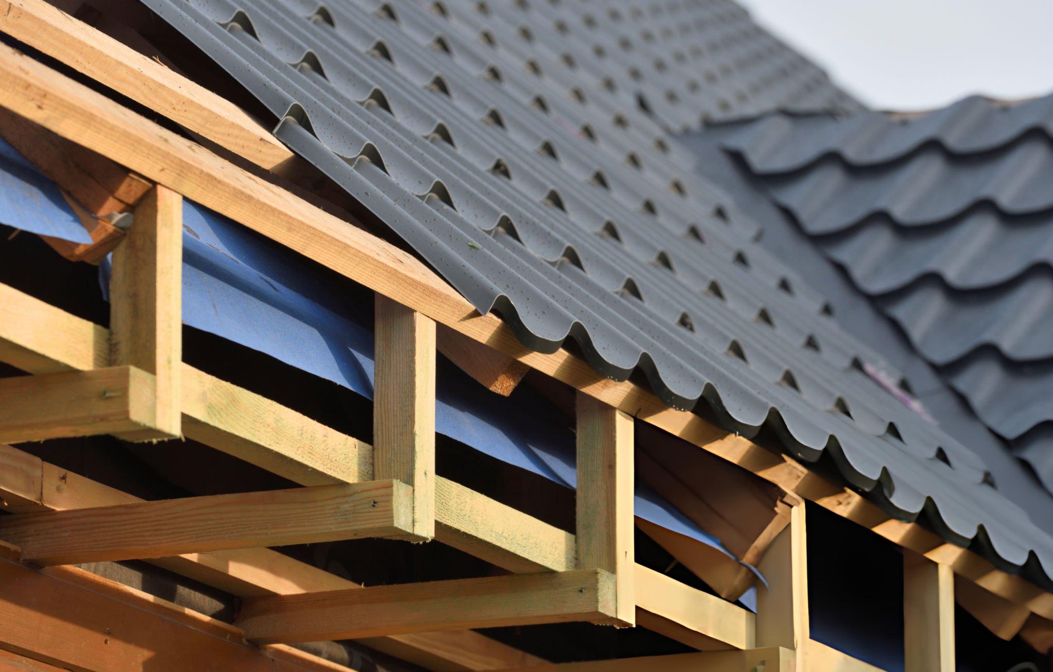 Butler CMFR-24 roof panel cross section showing 360 degree Pittsburgh double-lock standing seam floating clip attachment and rigid insulation integration for wood framed structures