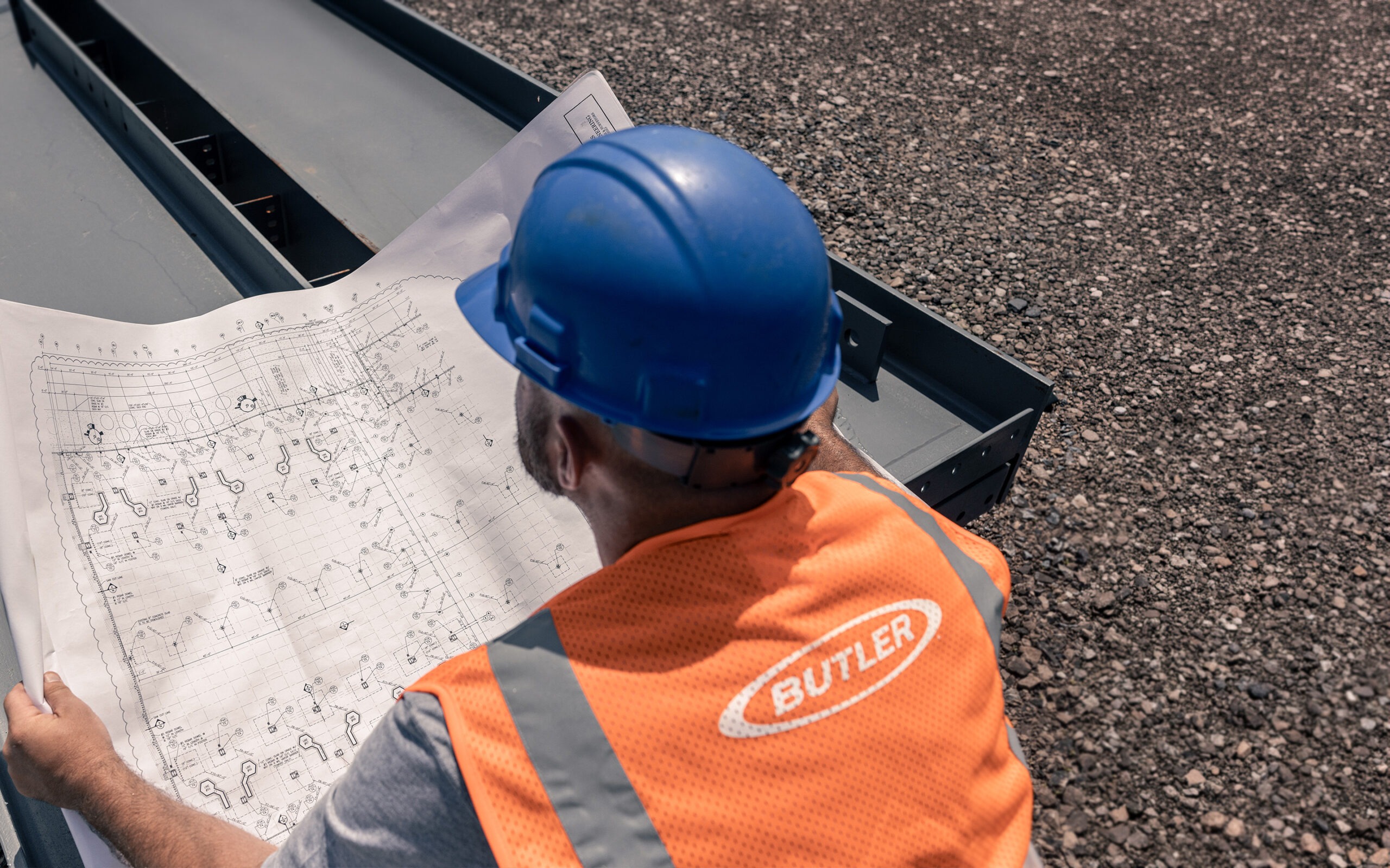 Butler metal building showing faded corroded or damaged wall panels in need of professional re-skin replacement using genuine OEM Butler Butlerib II Shadowall or Stylwall wall panels