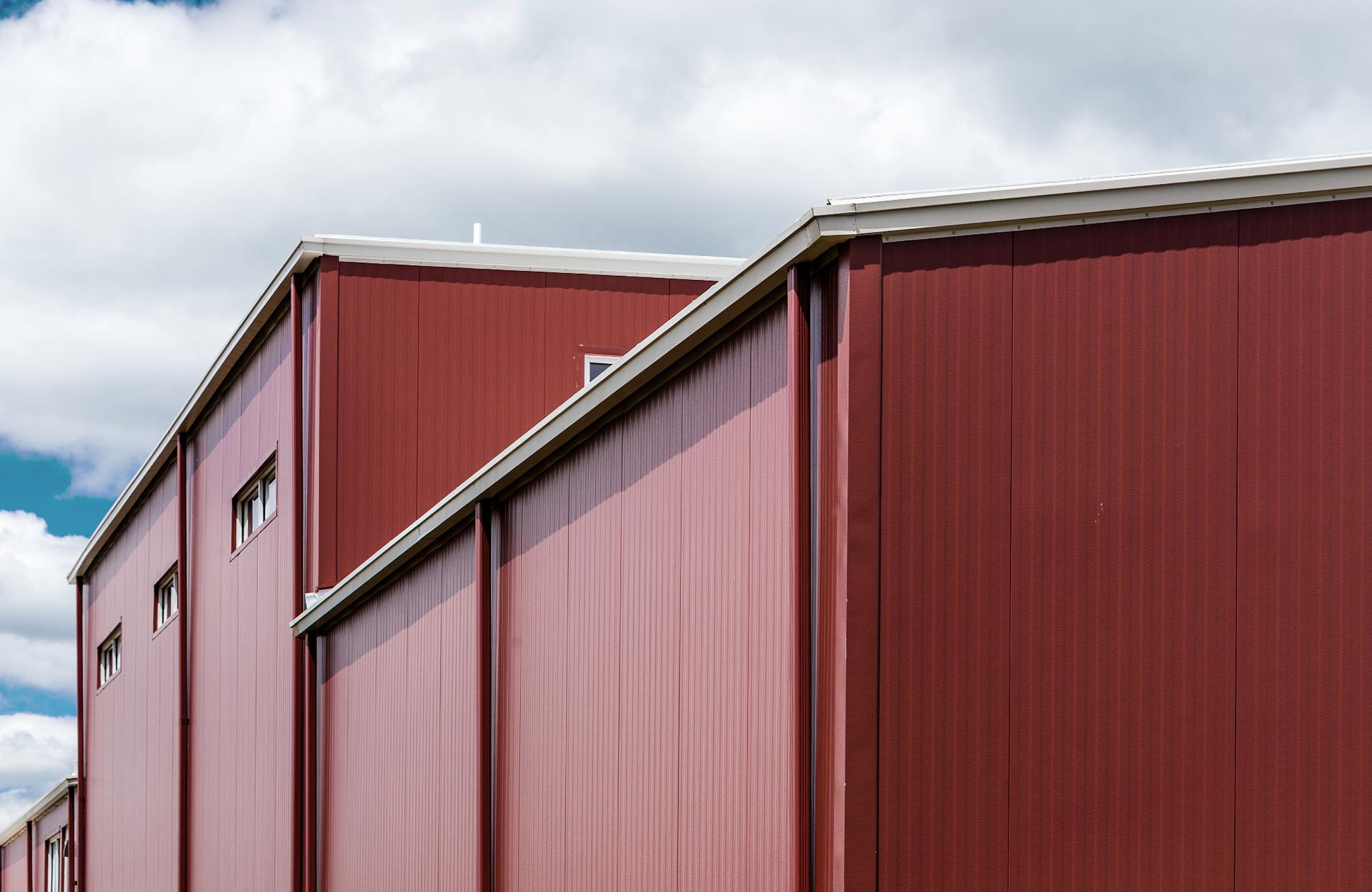 Butler Thermawall Flat IMP insulated metal sandwich panel installed on commercial building exterior