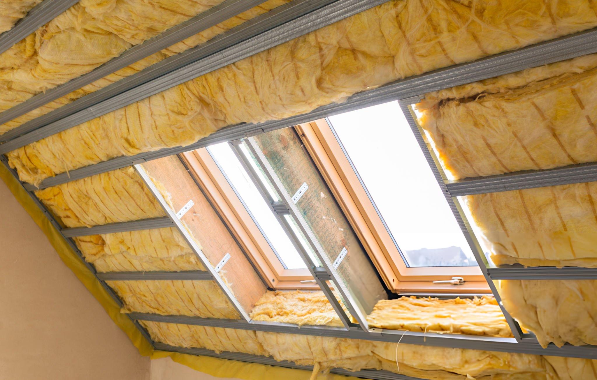 Butler building roof insulation banded system installed between purlins on commercial metal building roof assembly